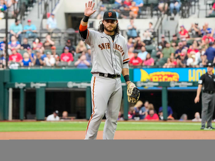 Jun 8, 2021; Arlington, Texas, USA; San Francisco Giants shortstop Brandon Crawford (35) is recognized as he takes the field for his 1,326th appearance at shortstop, setting a new record for the Giants, during the first inning against the Texas Rangers at Globe Life Field.